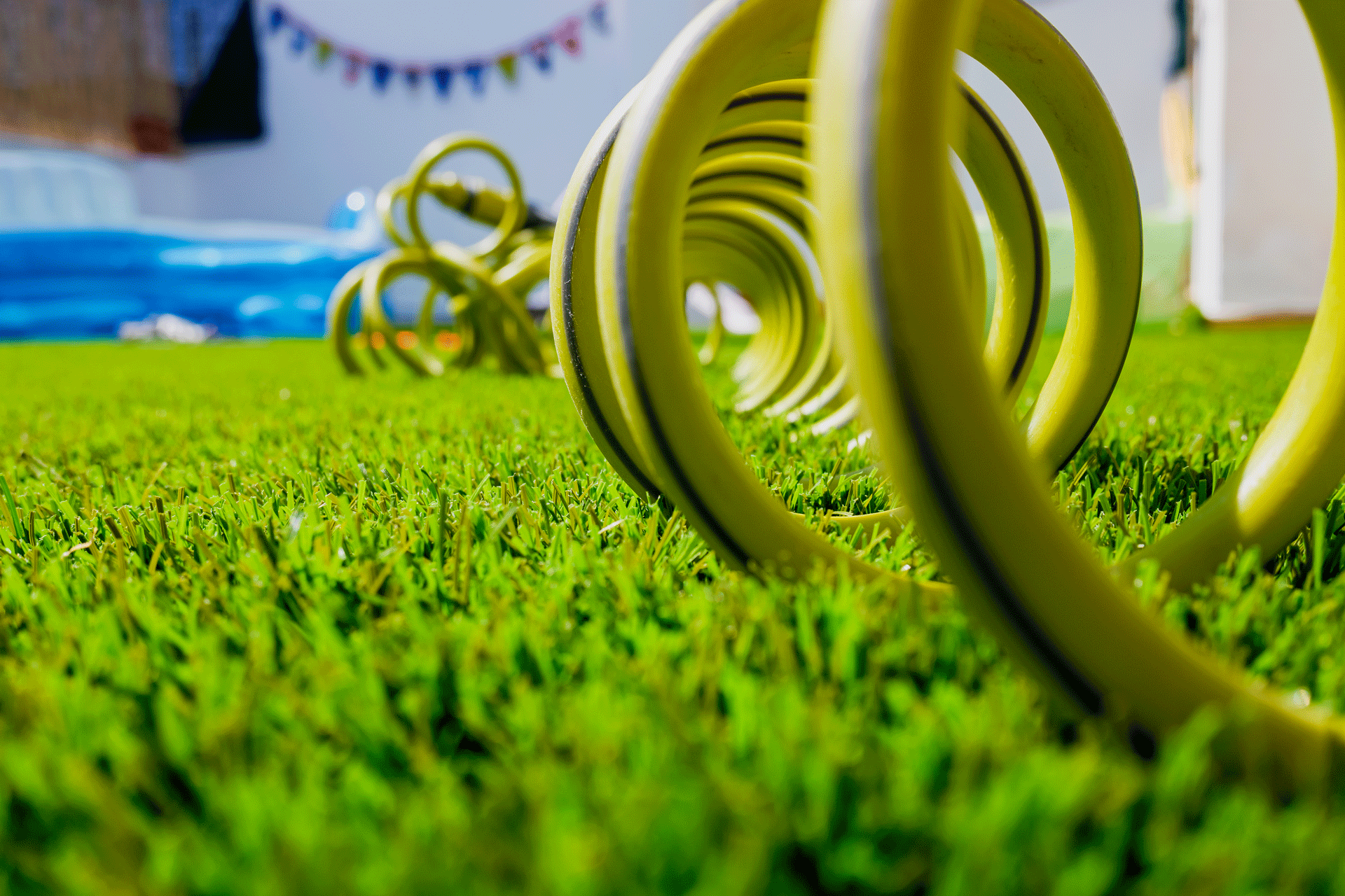 a-garden-on-a-terrace-with-a-hose-coiled-for-wate-2024-10-18-15-02-39-utc
